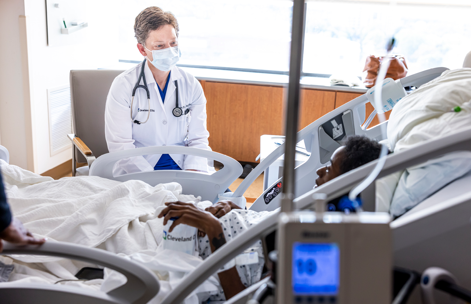 Image of a doctor talking to a cancer patient